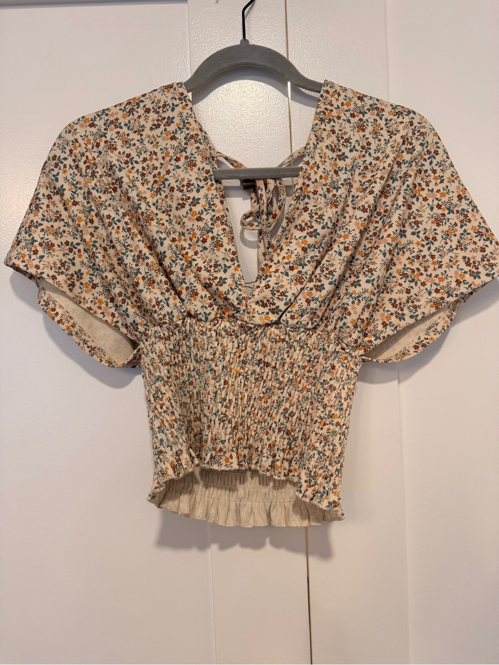 Pink Lily Cream Floral Smocked Peplum Top with Orange & Green Print